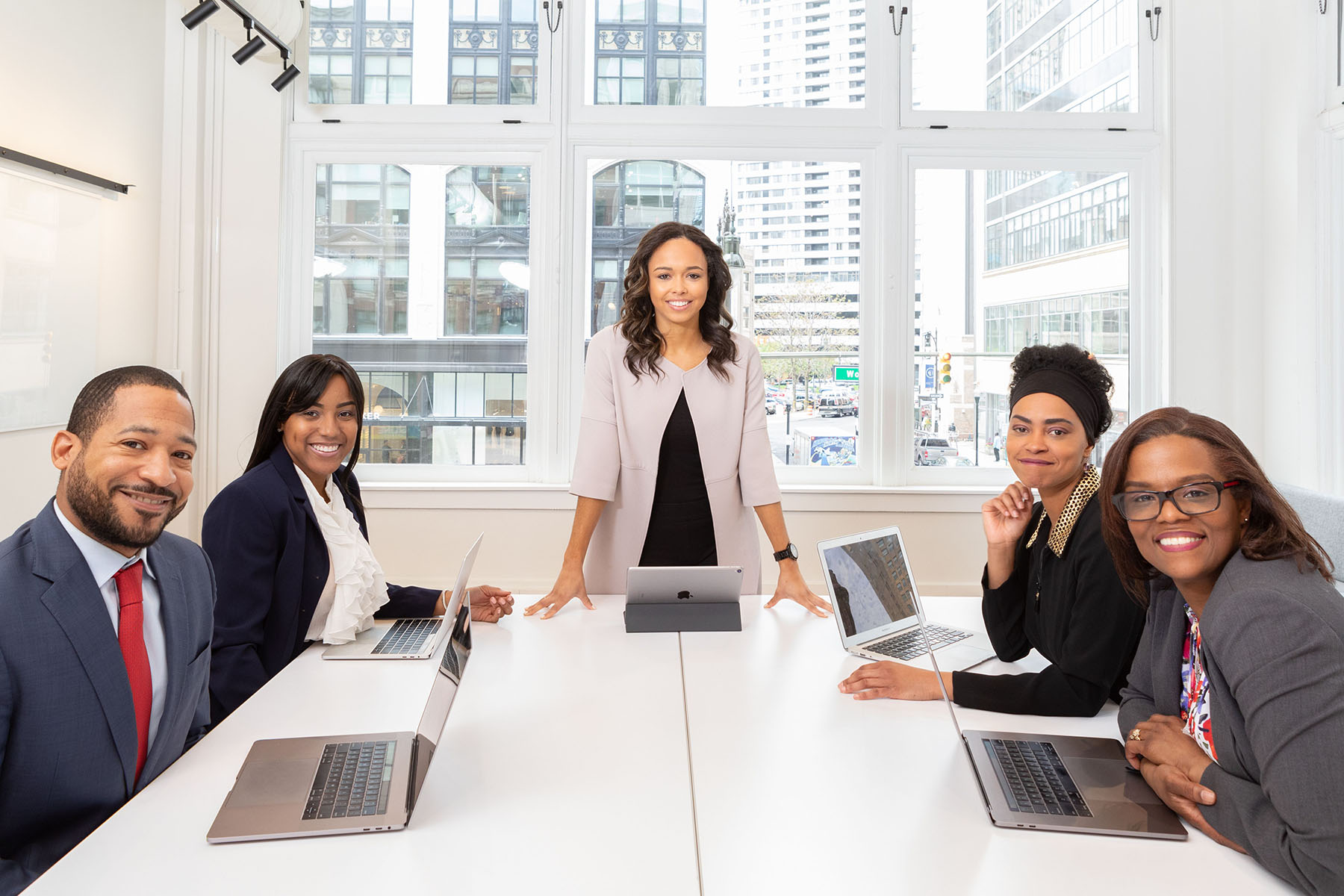 Diverse executive leadership team reviewing business performance data
